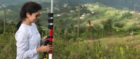 Puerto Rican land surveyor in the field