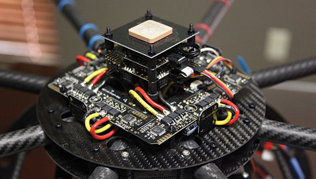 A close-up of the OctoXL Mikrokopter UAS with the hood removed to show the electronics.